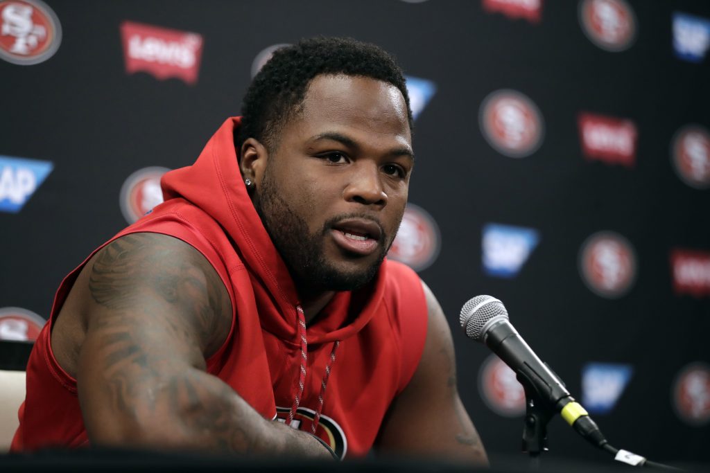 49ers running back Carlos Hyde answers questions during the first day of training camp