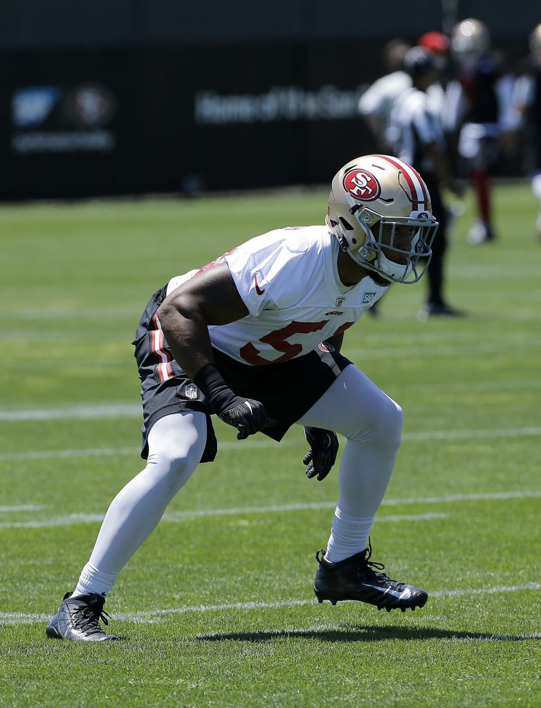 Linebacker Malcolm Smith warms up during 49ers training camp