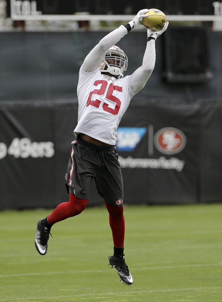 49ers safety Jimmie Ward catches a ball during practice