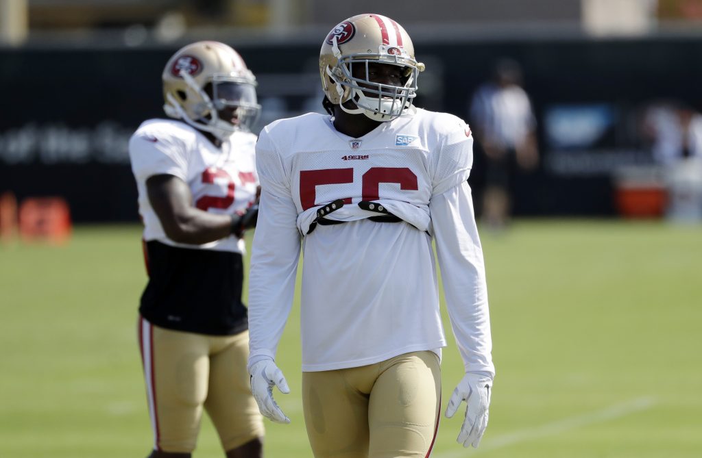 49ers linebacker Reuben stands on the field during practice