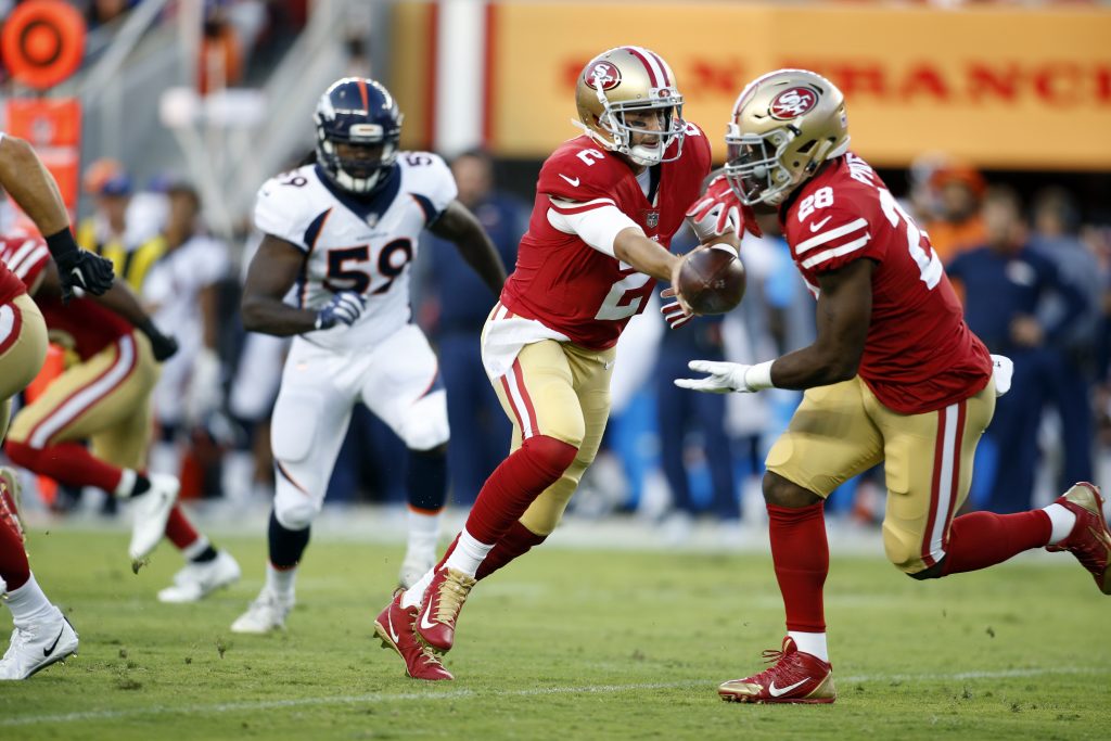 49ers quarterback Brian Hoyer hands the ball to running back Carlos Hyde